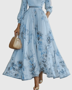 Rowella | Elegante abito lungo plissettato con scollo a V e cintura a nastro in vita