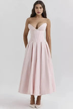 Vestido Laarni con corpiño esculpido y ballenas y falda voluminosa
